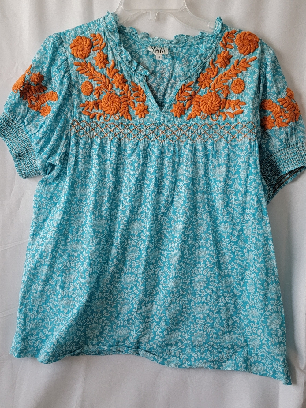 Sister Mary Aqua Top with orange embroidery